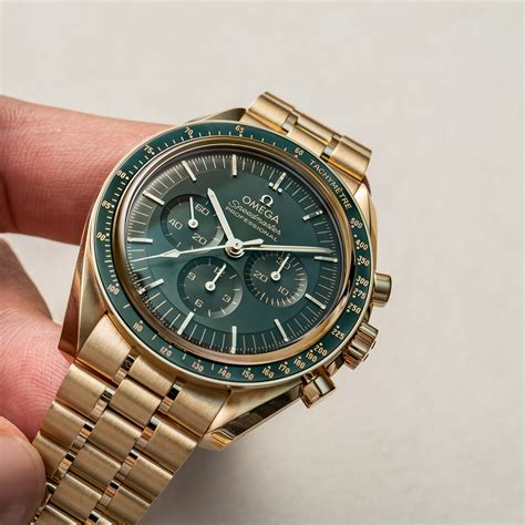 yellow gold speedmaster green dial